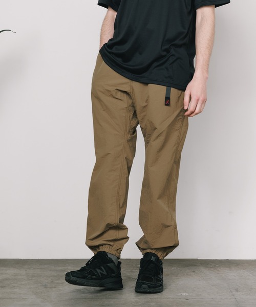 Gramicci(グラミチ)の「Gramicci/グラミチ NYLON TRACK PANT ナイロンパンツ(その他パンツ・メンズ・オリーブ/ブラック/ダークブラウン/ネイビー/ベージュ/ダークネイビー/ライトブラウン・S/M/L/XL/XXL)」の1枚目の写真