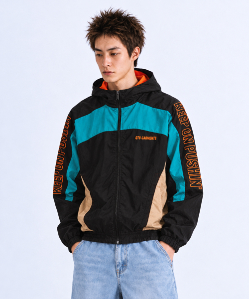 QT8 GARMENTS(キューティーエイトガーメント)の「MF Retro Hooded Track Jacket (ブラック/'ブルーグリーン/オレンジ)(ナイロンジャケット・レディース・その他・MEDIUM/LARGE/X-LARGE)」の1枚目の写真