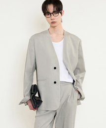 TNGT（ティーエヌジーティー）の「Kinoshita Seersucker Collarless Jacket (Light Beige) TNJA5E203I2（テーラードジャケット）」