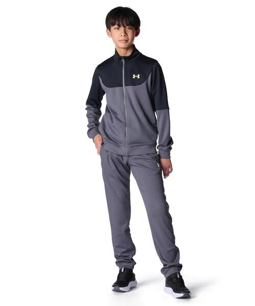UNDER ARMOUR(アンダーアーマー)の「UAカラーブロック ビッグロゴ トラックスーツ(トレーニング/キッズ)(その他トップス・キッズ・グレー×ホワイト・140cm/150cm/160cm)」の1枚目の写真