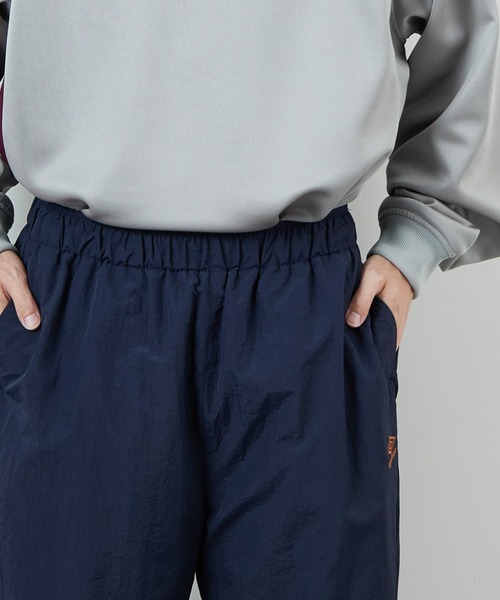 UMBRO（アンブロ）の「[UMBRO/アンブロ] 別注 ナイロントラックパンツ（その他パンツ・レディース・グレー/ネイビー・XL/L/M/S）」の20枚目の写真