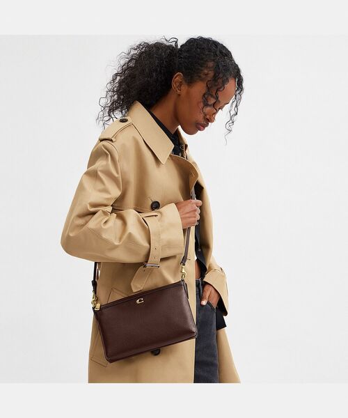 COACH（コーチ）の「レガシー ジップ トップ クロスボディ バッグ
