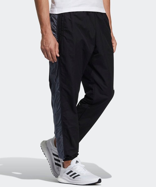 adidas（アディダス）の「ワード ウーブンパンツ [Word Woven