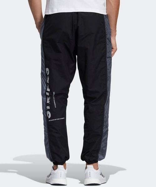 adidas（アディダス）の「ワード ウーブンパンツ [Word Woven