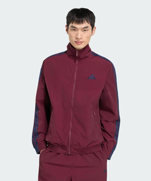 adidas(アディダス)の「スタジアム ライト ツイル ルーズフィット トラックジャケット / ジャージ / アディダス adidas(ジャージ・メンズ・レッド・X-SMALL/X-LARGE/MEDIUM/LARGE/XX-LARGE)」の1枚目の写真