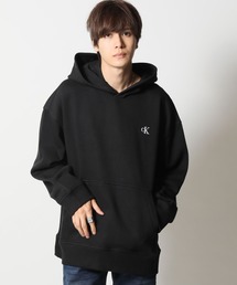 Calvin Klein（カルバン・クライン）の「Calvin Klein / カルバンクライン CKロゴ モノグラム スウェット パーカー LS ARCHIVE FLEECE PO HOODIE（パーカー・メンズ）」