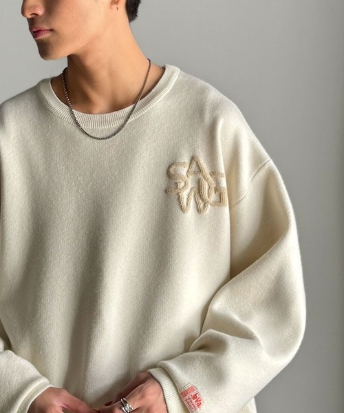 Java(ジャバ)の「《JaVaジャバコラボ》立体編みで飾る個性。サガラ刺繍風ロゴオーバーサイズニット(ニット/セーター・メンズ・ブラウン/チャコール/アイボリー・X-LARGE/MEDIUM/LARGE)」の2枚目の写真