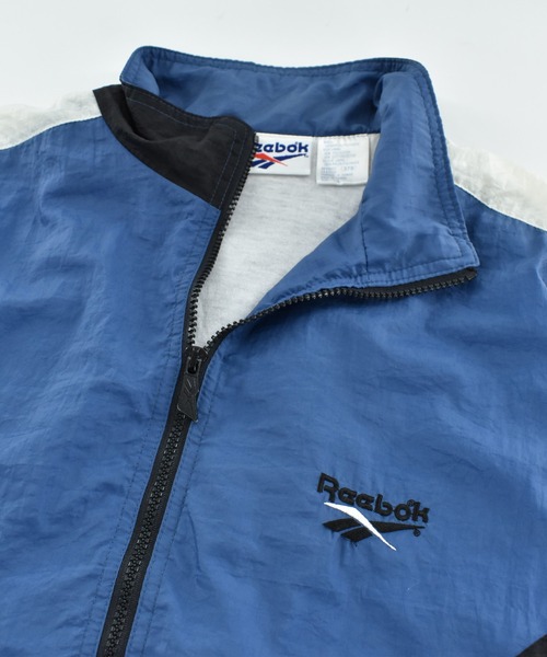 Reebok(リーボック)の「【USED】90’s Reebok ナイロン トラックジャケット(ナイロンジャケット・メンズ・ブルー・LARGE)」の2枚目の写真
