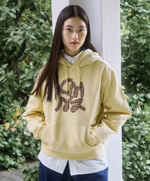 COMONINOZ（コモニノズ）の「W APPLIQUE SWEAT HOODIE [YELLOW]（パーカー）」