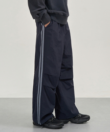 EXCONTAINER（エックスコンテナ）の「サイドラインナイロントラックパンツ（ネイビー）（スウェットパンツ）」