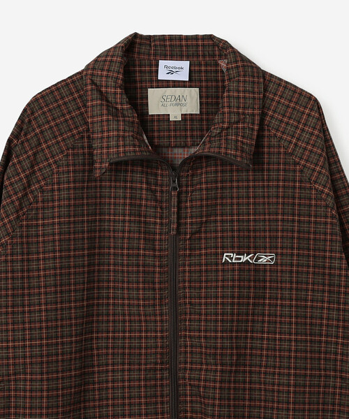 SEDAN ALL-PURPOSE(セダンオールパーパス)の「SEDAN ALL-PURPOSE | Reebok ナイロン トラックジャケット MEN(ナイロンジャケット・メンズ・ブラウン系その他・L/XL)」の8枚目の写真