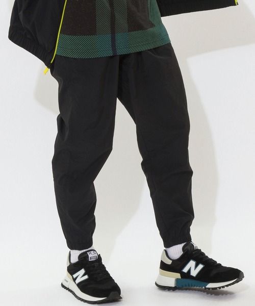 NEW BALANCE(ニューバランス)の「NB Athletics Higher Learning ウインドパンツ(その他パンツ・メンズ・ブラック/ネイビー/ブルー・SMALL/MEDIUM/LARGE/X-LARGE/XX-LARGE)」の12枚目の写真