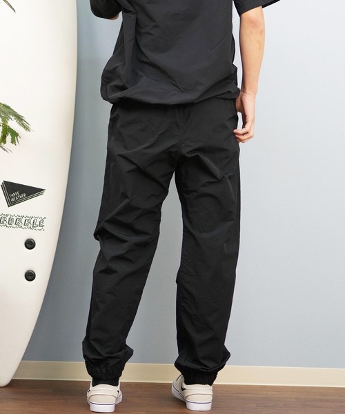 ムラサキスポーツ(ムラサキスポーツ)の「【ムラサキスポーツ限定】GRAMICCI×DEAR LAUREL ナイロントラックパンツ 水陸両用 撥水 セットアップ対応 GMP5-S2007(その他パンツ・メンズ・ブラック/ネイビー・M/L/XL)」の12枚目の写真