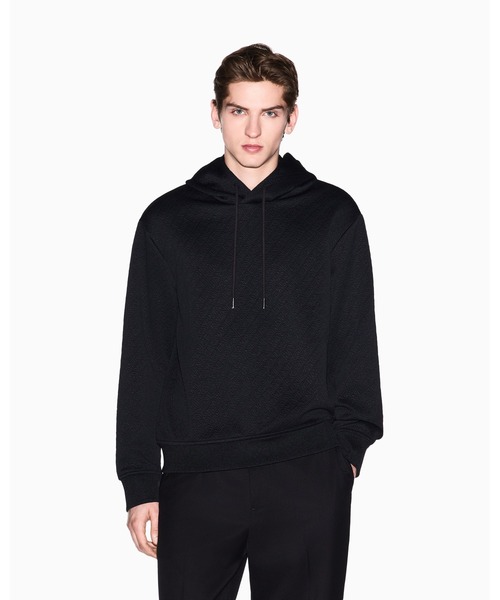 ARMANI EXCHANGE(アルマーニエクスチェンジ)の「【A|X アルマーニ エクスチェンジ】ダイアゴナル オールオーバージャカードロゴ フーデッドスウェットプルオーバー(スウェット・メンズ・ブラック/オフホワイト・X-SMALL/SMALL/MEDIUM/LARGE/XX-LARGE)」の2枚目の写真