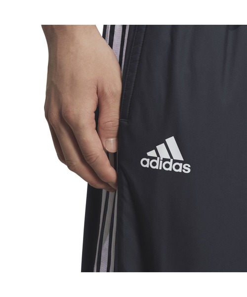 adidas(アディダス)の「アディダス adidas マストハブ スリーストライプス ルーズフィット WIND. RDY パデッドトラックパンツ(その他パンツ・メンズ・ブラック/ネイビー・S/M/L/LL/3L)」の9枚目の写真