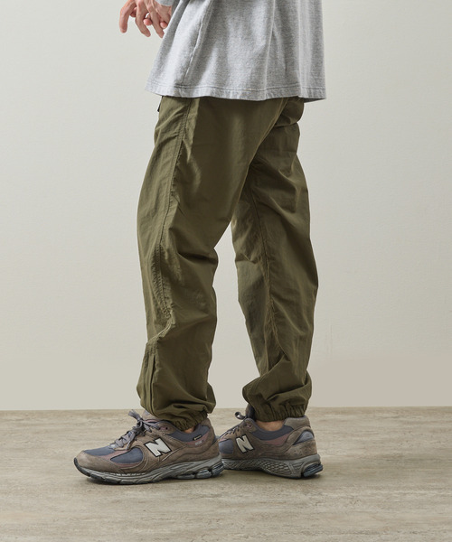 And A（アンドエー）の「Gramicci グラミチ / NYLON TRACK PANT 撥水防風ナイロントラックパンツ / G4SM-P119（その他パンツ・メンズ・オリーブ/ネイビー/ベージュ系その他/ブラック・SMALL/X-LARGE/LARGE/MEDIUM）」の7枚目の写真