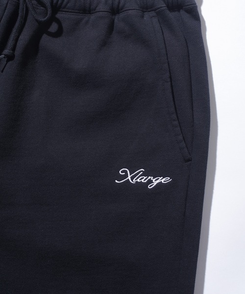 XLARGE(エクストララージ)の「【一部WEB限定】CURSIVE WIDE SWEAT PANTS(スウェットパンツ・メンズ・ブラック/アッシュ/ネイビー/グリーン・S/M/L/XL)」の15枚目の写真