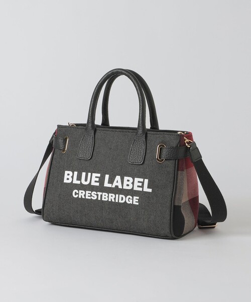 BLUE LABEL CRESTBRIDGE(ブルーレーベルクレストブリッジ)の「ロゴプリントハトメミドルトート(ハンドバッグ・レディース・オフホワイト/ブラック・FREE)」の1枚目の写真