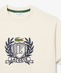 LACOSTE（ラコステ）の「ハンドステッチ風フレンチグラフィックTシャツ（Tシャツ/カットソー）」