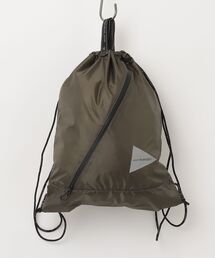and wander（アンドワンダー）の「and wander/アンドワンダー　CRISPY RIP LOGO DRAWSTRING　ナップサック（バックパック/リュック）」