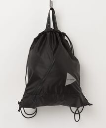 and wander | and wander/アンドワンダー　CRISPY RIP LOGO DRAWSTRING　ナップサック(バックパック/リュック)