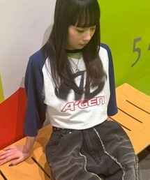 A'gem（エージェム）の「A'GEM/9 × .kom 『A'gem/エージェム』 ラグラン半袖Tシャツ（Tシャツ/カットソー）」