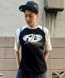 A'gem（エージェム）の「A'GEM/9 × .kom 『A'gem/エージェム』 ラグラン半袖Tシャツ（Tシャツ/カットソー）」