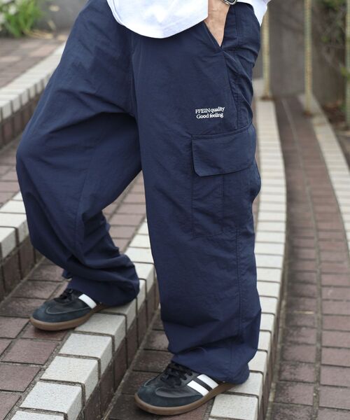 FFEIN(フェイン)の「【撥水加工】FFEIN(フェイン)カーゴナイロンワイドパンツ/ セットアップ ナイロンカーゴパンツ ワイドシルエット ドローコード(カーゴパンツ・メンズ・ブラック/アイボリー/ネイビー・SMALL/X-SMALL/LARGE/MEDIUM)」の13枚目の写真
