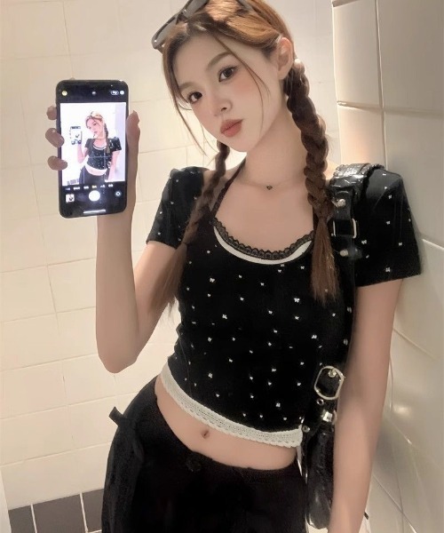 Ritzy(リッツィー)の「フェイクレイヤード リボンドット柄 ショート丈 トップス(Tシャツ/カットソー・レディース・ホワイト/ブラック・M/L)」の3枚目の写真