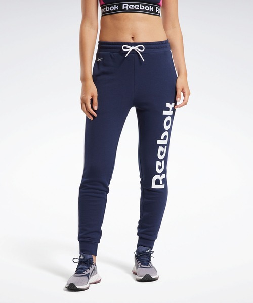 Reebok(リーボック)の「トレーニング エッセンシャルズ リニア ロゴ パンツ / Training Essentials Linear Logo Pants(スウェットパンツ・レディース・ブラック/ネイビー・SMALL/MEDIUM/LARGE/X-LARGE/X-SMALL)」の1枚目の写真