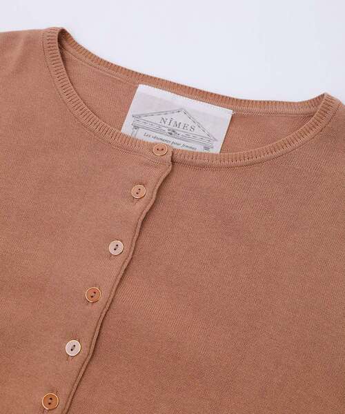 NIMES（ニーム）の「コンパクトスピン ボタンカーディガン（ニット/セーター・レディース・ベージュ/パープル/ミント/ブラック・99）」の7枚目の写真