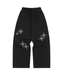 S'EST（エスイーエスティー）の「Twin Star Applique Training Pants Black（スウェットパンツ）」