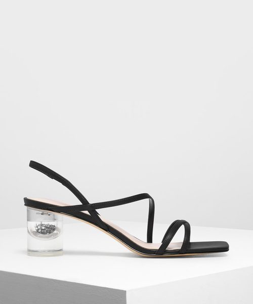 CHARLES & KEITH(チャールズ & キース)の「アシメトリカルストラップ ルーサイトヒールサンダル / Asymmetrical Strap Lucite Heel Sandals(サンダル・レディース・ゴールド/ブラック/ブルー/アイボリー・22.5cm/23cm/23.5cm/24.5cm/25cm)」の1枚目の写真