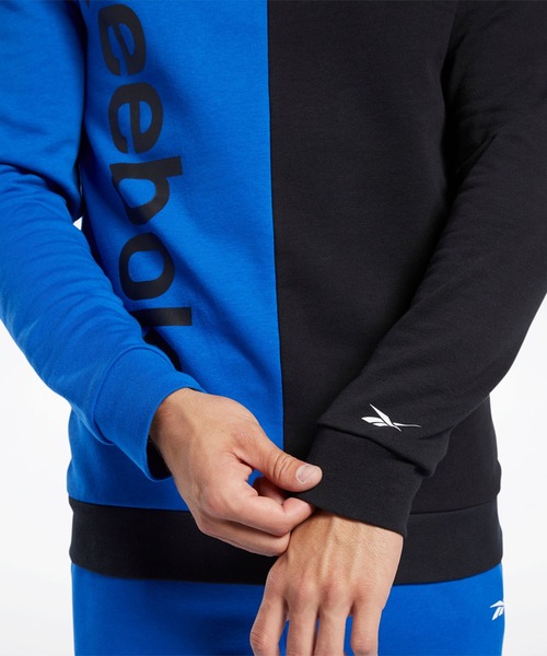 Reebok(リーボック)の「トレーニング エッセンシャルズ リニア ロゴ スウェットシャツ / Training Essentials Linear Logo Sweatshirt(スウェット・メンズ・ブラック/ブルー・SMALL/MEDIUM/XX-LARGE/X-LARGE/LARGE/XXX-LARGE)」の6枚目の写真