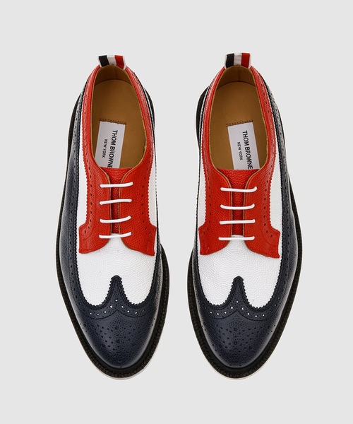 THOM BROWNE（トムブラウン）の「CLASSIC MULTICOLOR LONGWING SPECTATOR BROGUE W/ LEATHER SOLE IN PEBBLE GRAIN LEATHER（ドレスシューズ・メンズ・ホワイト×レッド・8/9）」の5枚目の写真