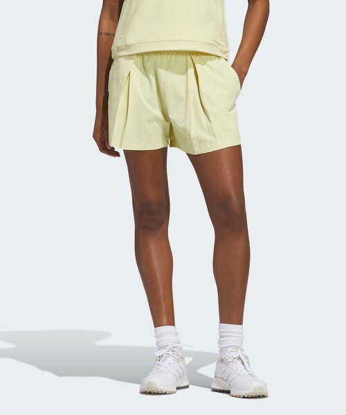 adidas(アディダス)の「ビヨンド ザ コース 撥水プリーツ ショートパンツ【adidas Golf/アディダスゴルフ】(その他パンツ・レディース・ライトイエロー・SMALL/MEDIUM/LARGE/X-LARGE/XX-LARGE)」の1枚目の写真