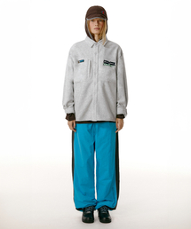 TEKET（テケット）の「Jingle Words Track Pants Blue（スウェットパンツ）」