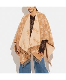 coach スウェードポンチョ COACH（コーチ）の「リバーシブル ホース アンド キャリッジ