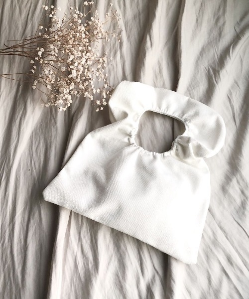 Kotoe(コトエ)の「キャンバス調シャーリングハンドバッグ(ハンドバッグ・レディース・ホワイト/ブラック・FREE)」の1枚目の写真