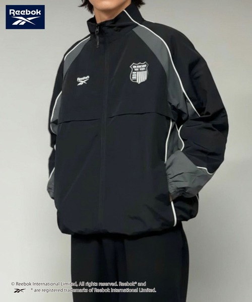 Reebok(リーボック)の「Reebok Emblem Detail Nylon Jacket/リーボック エンブレムディテール ナイロン トラックジャケット(ナイロンジャケット・メンズ・ブラック系その他/グレー系その他・XL/L/M)」の1枚目の写真