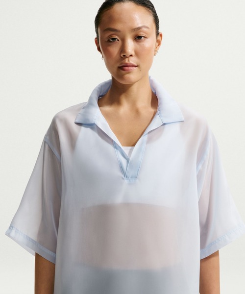 NIKE(ナイキ)の「ナイキ スポーツウェア ウィメンズ オーバーサイズド シアー トップス / Nike Sportswear Women's Oversized Sheer Top IR1681-407 Hydrogen Blue(ポロシャツ・レディース・クリアブルー・XS/XL/S/M/L/2XL)」の1枚目の写真