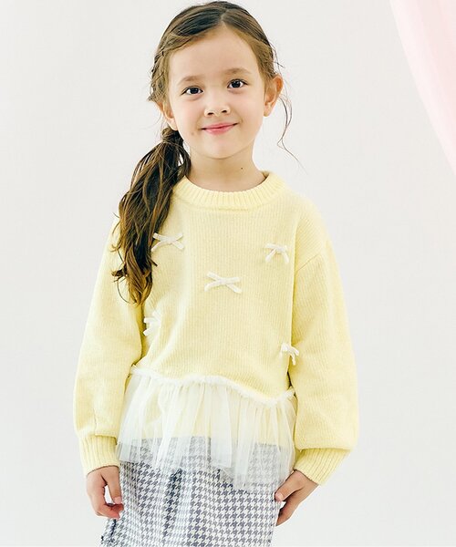 apres les cours(アプレレクール)の「【ジュニア対応】ペプラムチュールリボンニット(ニット/セーター・キッズ・イエロー/アイボリー・90/100/110/120/130/140)」の1枚目の写真