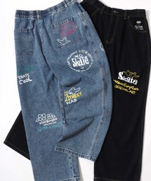 Mark Gonzales（マーク・ゴンザレス）の「MARK GONZALES ARTWORK COLLECTION/マークゴンザレス 別注 ストリートデザイン 総柄プリント ワイドデニムパンツ（デニムパンツ）」