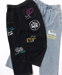 Mark Gonzales（マーク・ゴンザレス）の「MARK GONZALES ARTWORK COLLECTION/マークゴンザレス 別注 ストリートデザイン 総柄プリント ワイドデニムパンツ（デニムパンツ）」