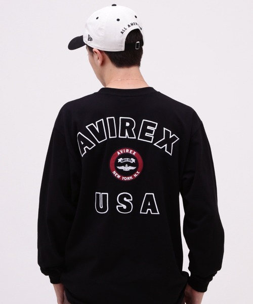 AVIREX（アヴィレックス）の「VARSITY LOGO LONGSLEEVE T-SHIRT / バーシティ ロゴ 長袖Tシャツ / AVIREX / アヴィレックス（Tシャツ/カットソー・メンズ・オフホワイト/オレンジ/ネイビー/ブラック・XX-LARGE/X-LARGE/MEDIUM/LARGE）」の2枚目の写真