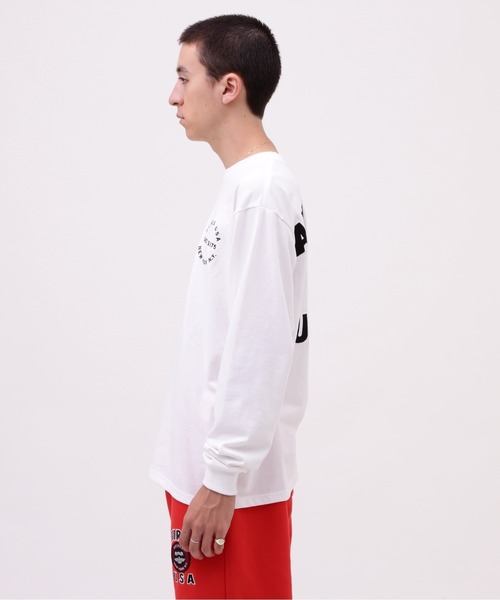 AVIREX（アヴィレックス）の「VARSITY LOGO LONGSLEEVE T-SHIRT / バーシティ ロゴ 長袖Tシャツ / AVIREX / アヴィレックス（Tシャツ/カットソー・メンズ・オフホワイト/オレンジ/ネイビー/ブラック・XX-LARGE/X-LARGE/MEDIUM/LARGE）」の9枚目の写真