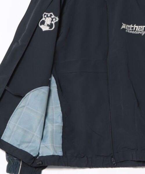 Revo.（レボ）の「オーバーサイズ パイピング 総柄切替 トラックジャケット ワンポイント ロゴ刺繍 スタンドカラー ナイロンブルゾン（ナイロンジャケット・メンズ・ブラック/ネイビー/グレー・M/L）」の5枚目の写真