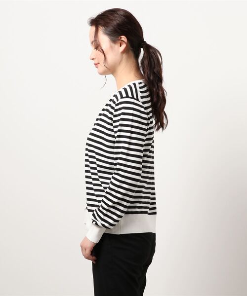 Te chichi(テチチ)の「Tバー釦クルーネックカーディガン(カーディガン/ボレロ・レディース・ブラック/オフホワイト/シルバー/オレンジ/モカ・フリ-)」の6枚目の写真