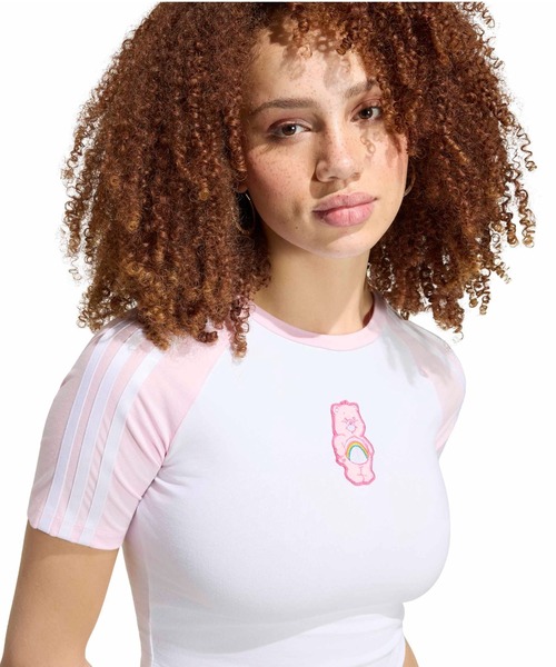 adidas(アディダス)の「adidas CARE BEARS BABY TEE / アディダス ケアベア ベビー Tシャツ(Tシャツ/カットソー・レディース・ホワイト×ピンク・L/M/S)」の2枚目の写真