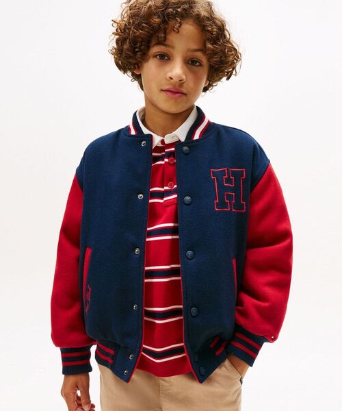 TOMMY HILFIGER(トミーヒルフィガー)の「BOYS リバーシブルトミーグラフィックボンバージャケット(ブルゾン・キッズ・ネイビー・160cm/130cm/150cm/140cm)」の1枚目の写真